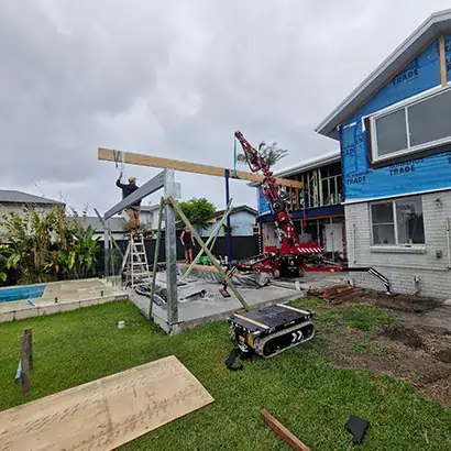 Transporting and installing heavy structural steel beams using a compact spider crane