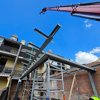 A 350kg skylight lifted safely near overhead power lines with a tight access setup on the Central Coast