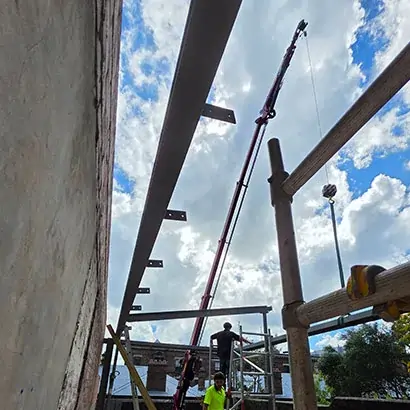 Clean and safe boutique construction site featuring a stationary Narrowtech crane